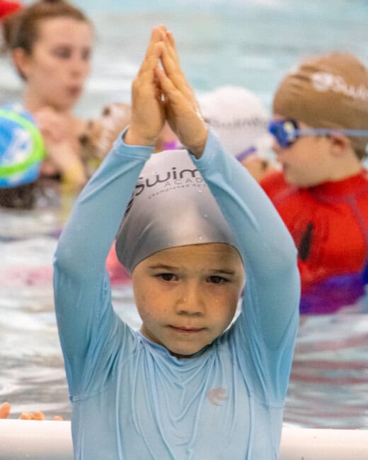 Kid swimming at a Swim Intensive.