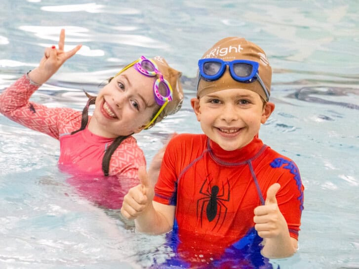 Kids smiling during the Swim Intensive.