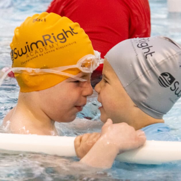 Kids playing with each other at a Swim Intensive.