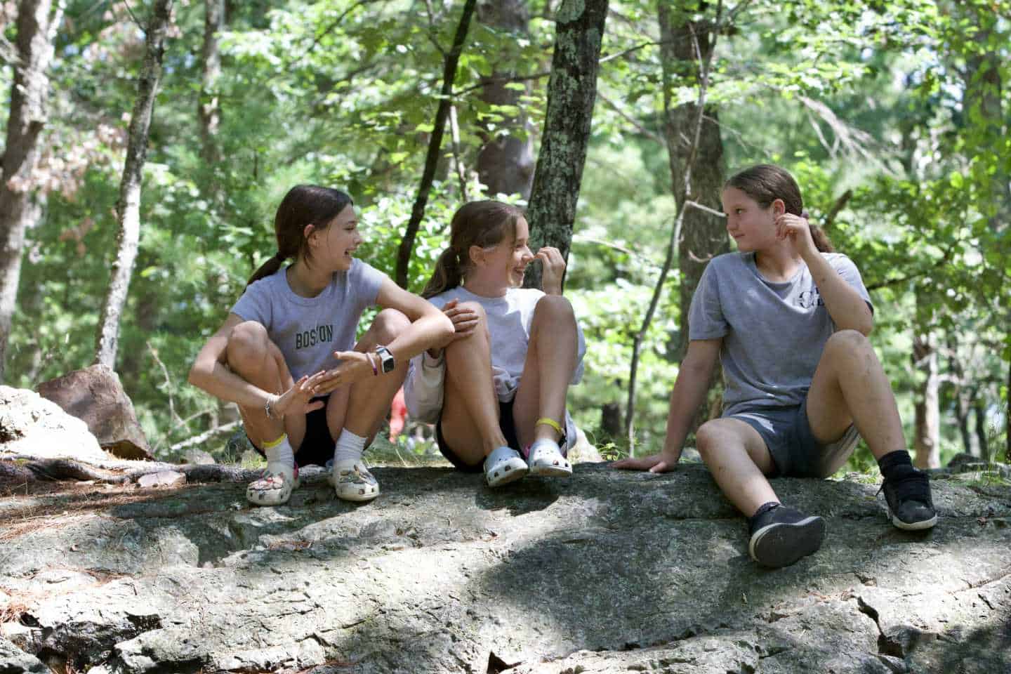 Kids sitting together at Camp Grossman.